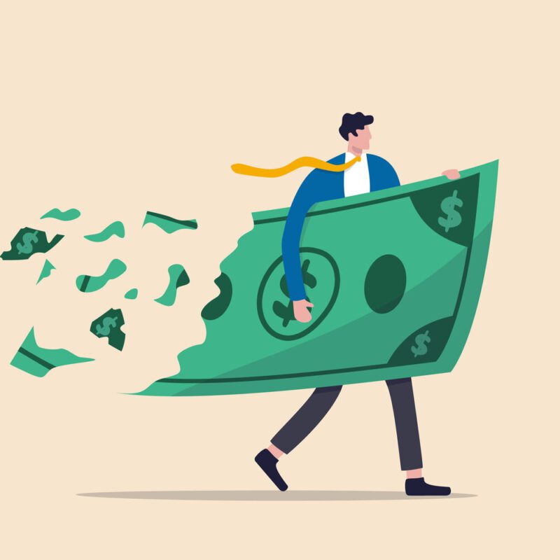 Man holding a large, disintegrating dollar bill